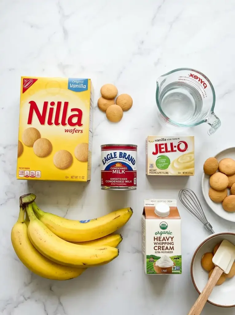 Ingredients needed for easy copycat Magnolia Bakery banana pudding, including bananas, pudding mix, and vanilla wafers.